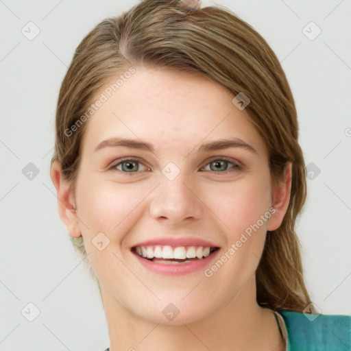 Joyful white young-adult female with medium  brown hair and green eyes