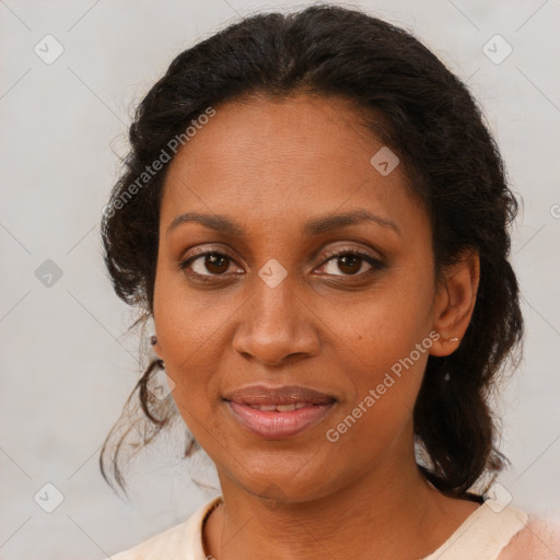 Joyful black adult female with medium  brown hair and brown eyes