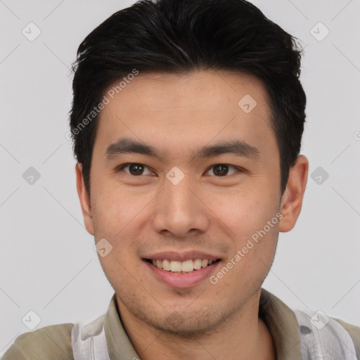 Joyful asian young-adult male with short  black hair and brown eyes