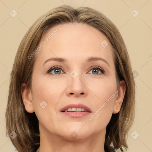 Joyful white adult female with medium  brown hair and grey eyes