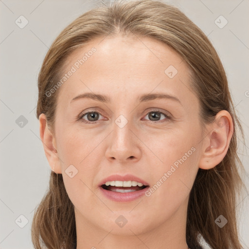 Joyful white young-adult female with long  brown hair and grey eyes