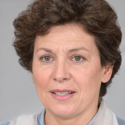 Joyful white middle-aged female with medium  brown hair and brown eyes