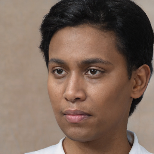 Neutral black young-adult male with short  black hair and brown eyes