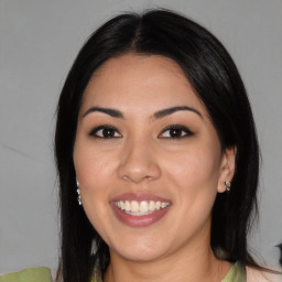 Joyful asian young-adult female with medium  black hair and brown eyes