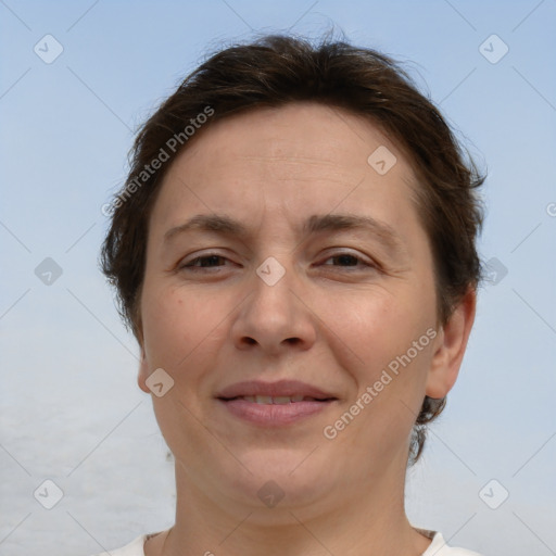 Joyful white adult female with short  brown hair and brown eyes