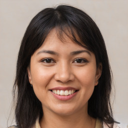 Joyful white young-adult female with medium  brown hair and brown eyes