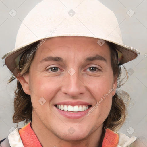 Joyful white adult female with medium  brown hair and blue eyes