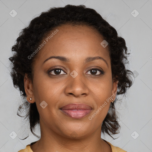 Joyful black adult female with medium  brown hair and brown eyes