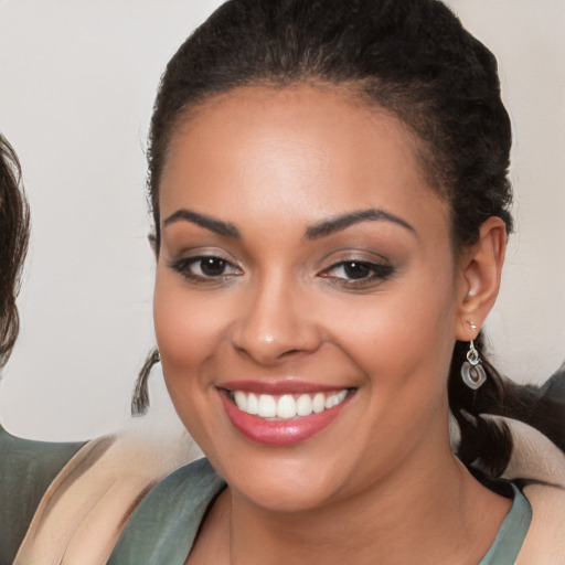 Joyful white young-adult female with medium  brown hair and brown eyes