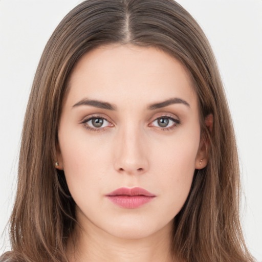 Neutral white young-adult female with long  brown hair and brown eyes