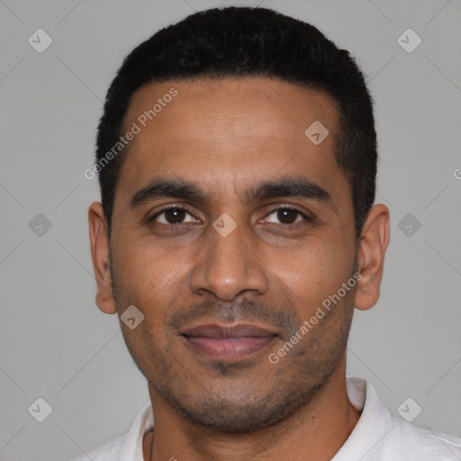 Joyful latino young-adult male with short  black hair and brown eyes