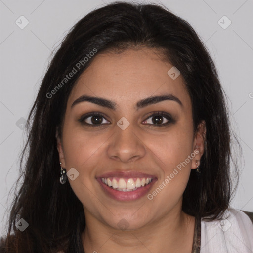 Joyful latino young-adult female with long  brown hair and brown eyes