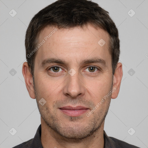 Joyful white adult male with short  brown hair and brown eyes