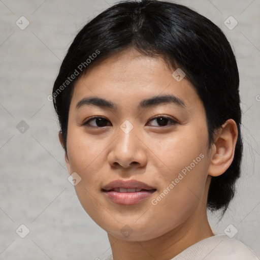 Joyful asian young-adult female with medium  black hair and brown eyes