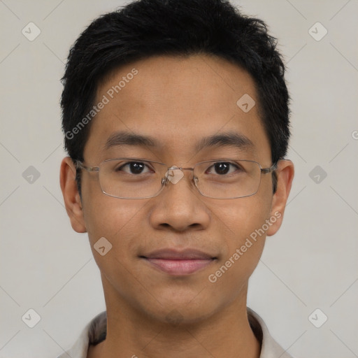 Joyful asian young-adult male with short  black hair and brown eyes