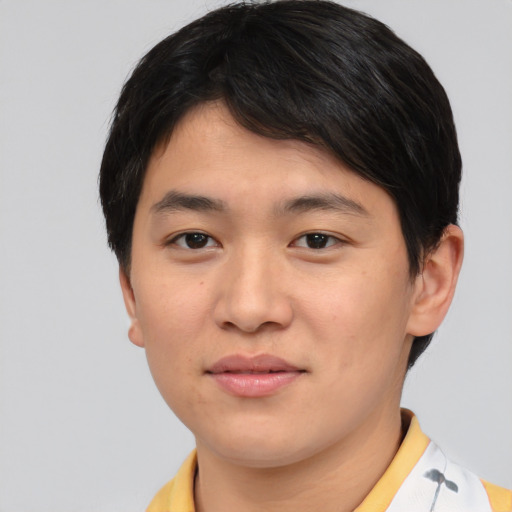 Joyful asian young-adult male with short  brown hair and brown eyes