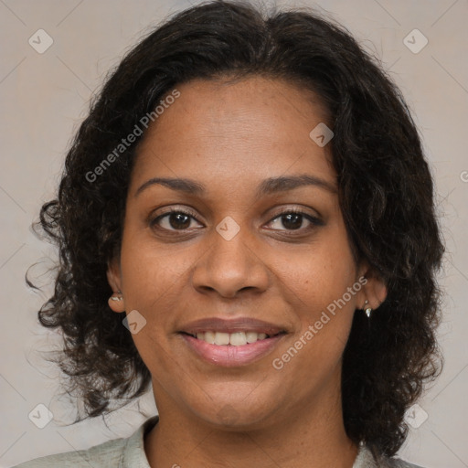 Joyful black young-adult female with medium  brown hair and brown eyes