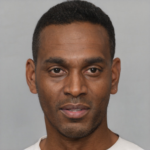 Neutral black young-adult male with short  black hair and brown eyes
