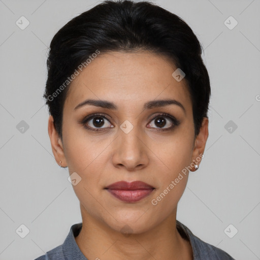 Joyful latino young-adult female with short  black hair and brown eyes