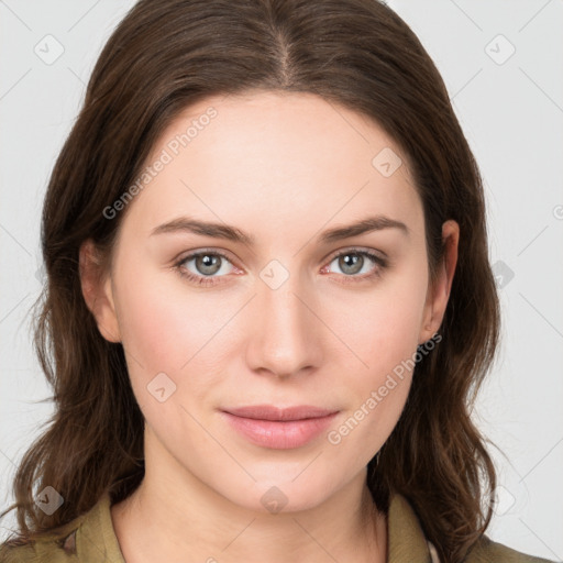 Joyful white young-adult female with medium  brown hair and green eyes