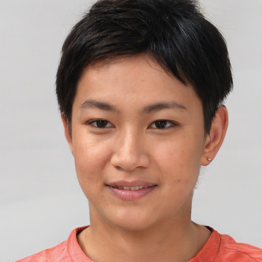 Joyful asian young-adult female with short  brown hair and brown eyes