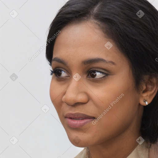 Joyful latino young-adult female with long  black hair and brown eyes