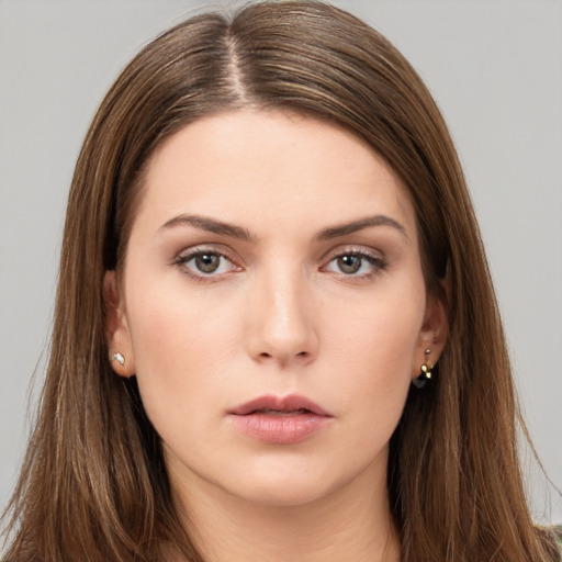 Neutral white young-adult female with long  brown hair and brown eyes