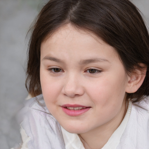 Joyful white child female with medium  brown hair and brown eyes