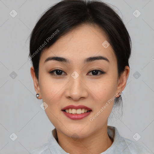 Joyful asian young-adult female with short  black hair and brown eyes