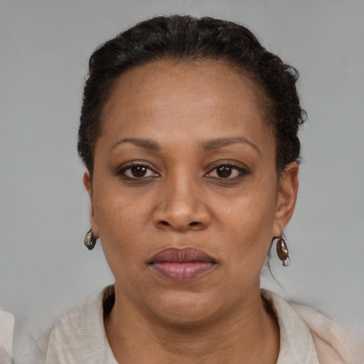 Neutral black adult female with short  black hair and brown eyes