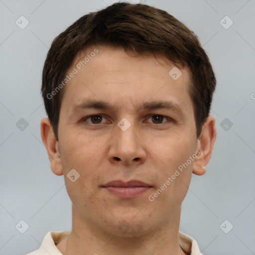 Joyful white adult male with short  brown hair and brown eyes