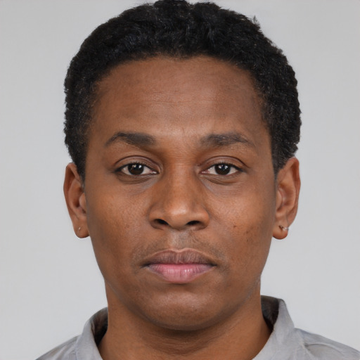Neutral black young-adult male with short  black hair and brown eyes