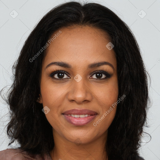 Joyful black young-adult female with long  brown hair and brown eyes