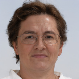 Joyful white middle-aged female with short  brown hair and brown eyes