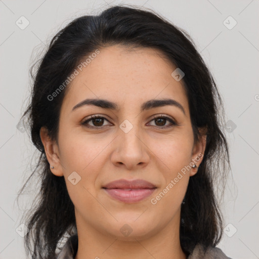 Joyful latino young-adult female with medium  brown hair and brown eyes