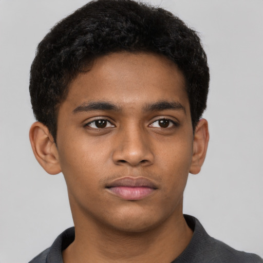 Neutral black young-adult male with short  brown hair and brown eyes