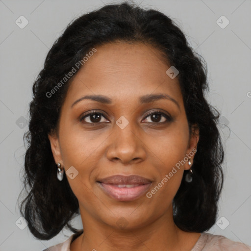 Joyful black adult female with medium  brown hair and brown eyes