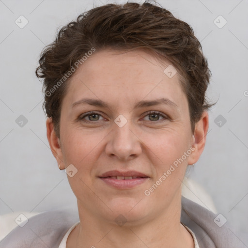 Joyful white adult female with short  brown hair and grey eyes