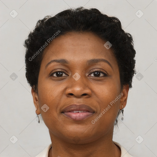 Joyful black adult female with short  brown hair and brown eyes