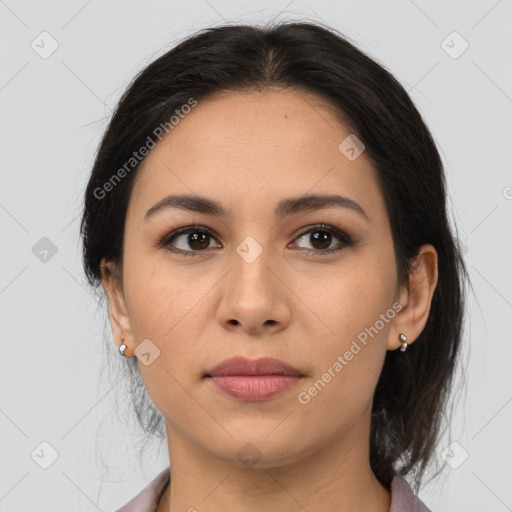 Joyful latino young-adult female with medium  brown hair and brown eyes