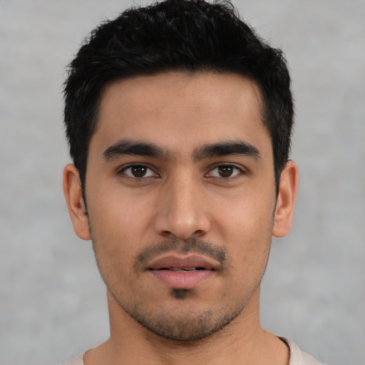 Neutral latino young-adult male with short  black hair and brown eyes
