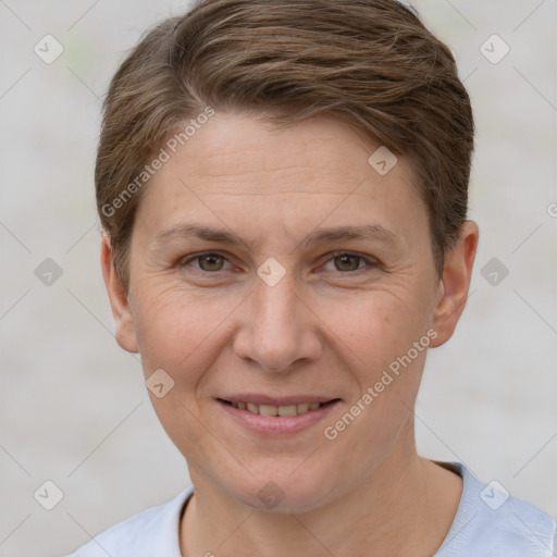 Joyful white adult female with short  brown hair and brown eyes