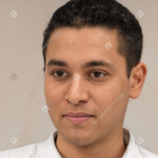 Joyful white young-adult male with short  black hair and brown eyes