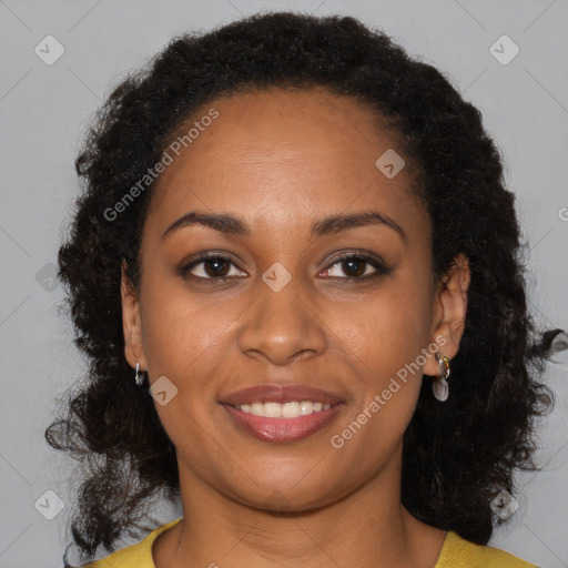 Joyful black young-adult female with long  brown hair and brown eyes