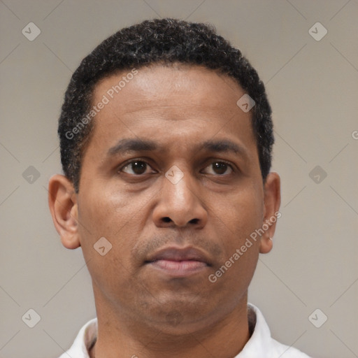 Neutral latino adult male with short  brown hair and brown eyes