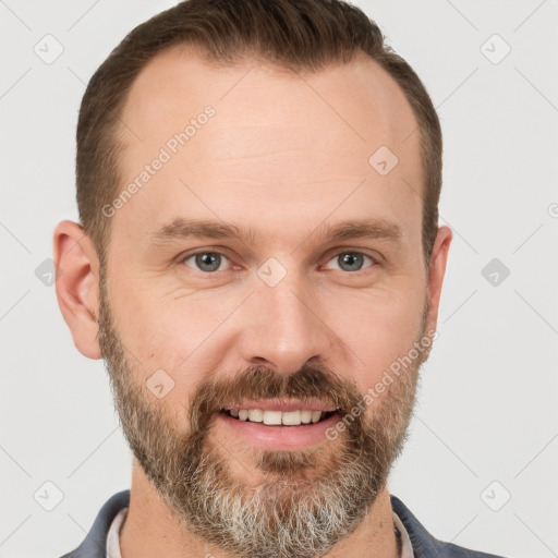 Joyful white adult male with short  brown hair and grey eyes