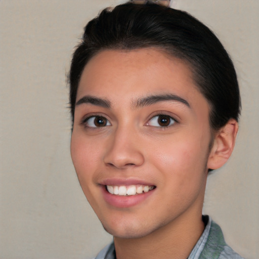 Joyful white young-adult female with short  black hair and brown eyes