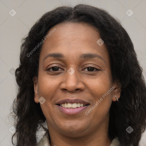 Joyful black adult female with medium  brown hair and brown eyes