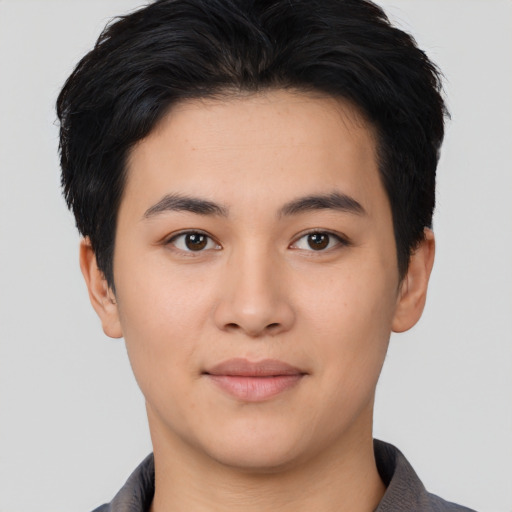 Joyful asian young-adult female with short  black hair and brown eyes