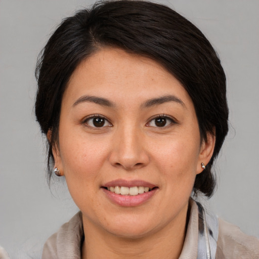 Joyful white young-adult female with medium  brown hair and brown eyes